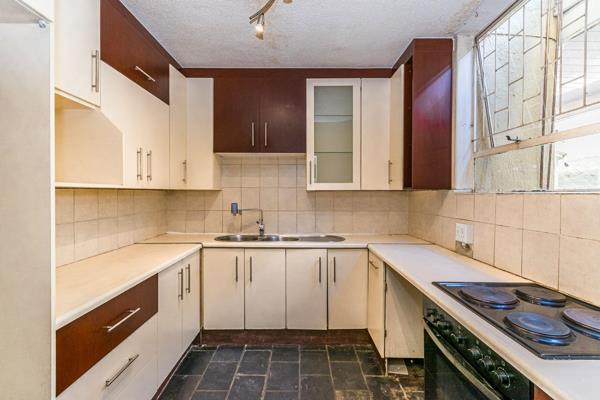 This unit offers a tiled and fully fitted kitchen with generous cupboard space and ...