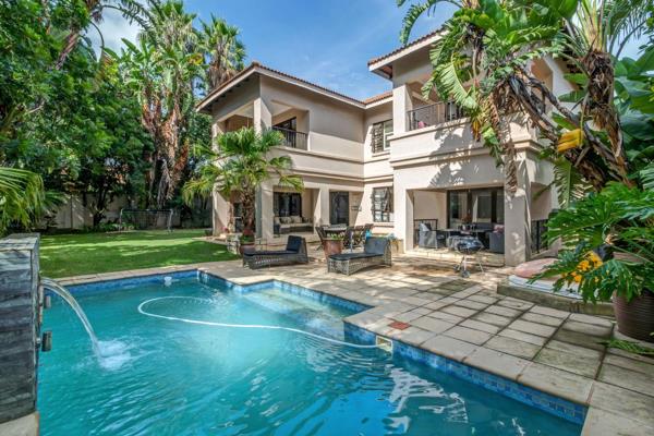 Expanded family home set in a lush tropical garden nestled in a secure estate. Gate with a private forecourt welcomes you and leads to ...