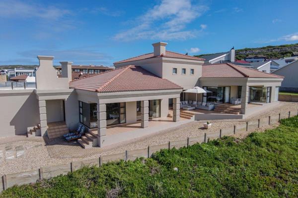 EXCLUSIVE MANDATE

Perched majestically along the azure coastline of Jongensfontein, this extraordinary residence offers a lifestyle of ...