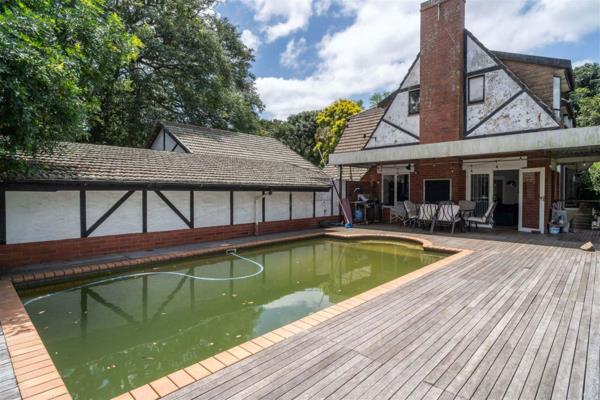 In this exquisite double storey Tudor-style home nestled in a tranquil cul-de-sac. Revel in the grandeur of high ceilings and the ...