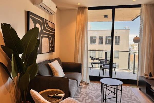 Furnished studio apartment with open balcony facing Signal Hill.  Equipped with excellent quality furnishings and essentials and has ...