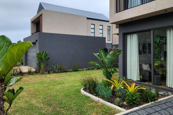 This stunning home with a striking, sculptural design offers a luxurious and stylish living space. The open-plan living area seamlessly ...