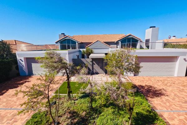 Exclusive Sole Mandate

Situated on the prestigious 1st Fairway, just 400 meters from the clubhouse, this immaculate residence embodies the perfect fusion of luxury, technology, and breathtaking natural surroundings. Completed in December 2017, this modern Cape Vernacular ...