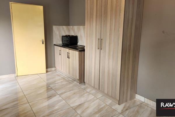 A bachelor unit for single occupancy only, featuring an open-plan room and a separate bathroom with a shower, toilet, and hand basin. ...