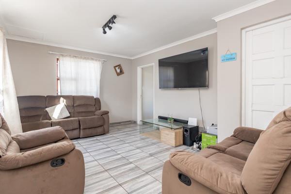 Three spacious bedrooms with built in cupboards and tiled floors. Tiled lounge, dining ...