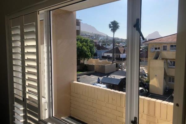 Renovated two bedroom apartment with views of Lions Head.
Open plan kitchen and lounge. Kitchen equipped with Fridge, dishwasher and ...