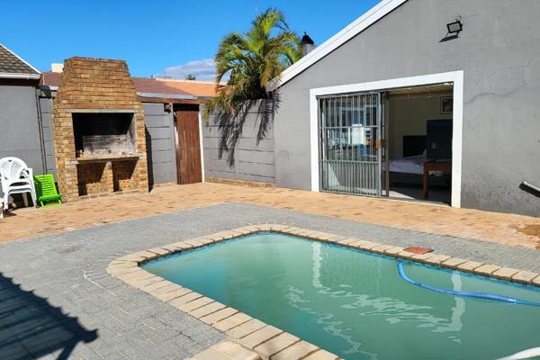 Very Private Home with fantastic features and new kitchen with gas hobb, modern indoor braai area that boasts a bar opening on the pool ...