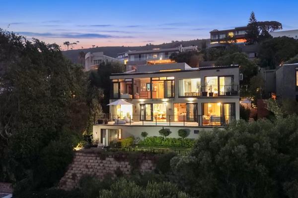This stunning property spans three levels, offering breath-taking views of the City ...