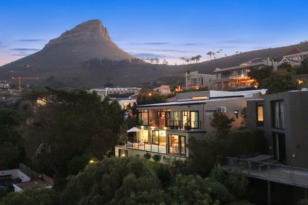 This stunning property spans three levels, offering breath-taking views of the City Bowl, Table Mountain, and the Cape Town skyline ...