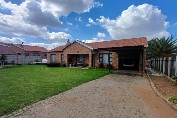 Step onto the front stoop and be greeted by a built-in braai, perfect for entertaining guests or enjoying quiet evenings. 

Inside ...