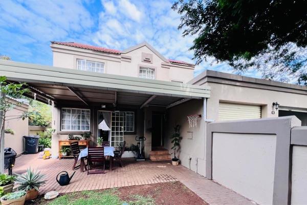 The seamless integration of open-plan living areas, extending graciously onto a picturesque patio, creates an inviting ambiance for ...