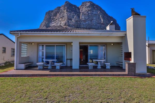 This sea-front house at the foot of Hangklip Mountain is located within the exclusive ...