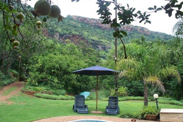 A piece of paradise close to Waterval Boven.     This farm of 28,1408 hectares in size, consists of a beautiful guest house, 5 open ...