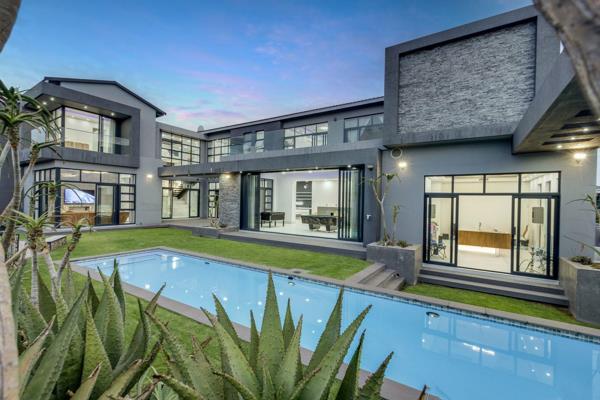 State of the art lighting and exceptional views complements modern day living and is a key element to this home. The double volume ...