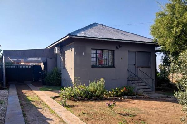 In the market for a starter home or investment? - This property located on a corner plot ...