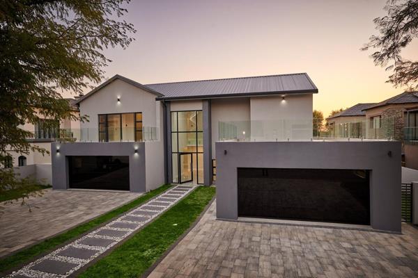 Dazzling and modern, this newly completed family home offers the finest finishes and ...