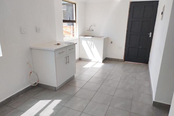 This newly renovated flat offers the following:

- 2 Bedrooms
- 1 Bathroom
- Combined lounge and dining
- Kitchen with no stove
- ...