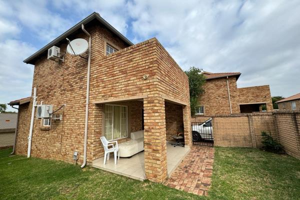 Modern Duplex Townhouse in Cosmos View Estate

Open plan lounge/dining room with a ...