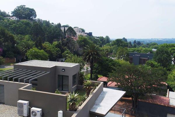 Welcome to this exquisite penthouse apartment located in Forest Town, Johannesburg, just ...