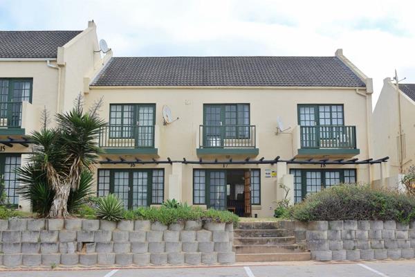 Nestled along the picturesque beachfront of Port Alfred, this delightful two-bedroom townhouse offers a perfect blend of seaside ...