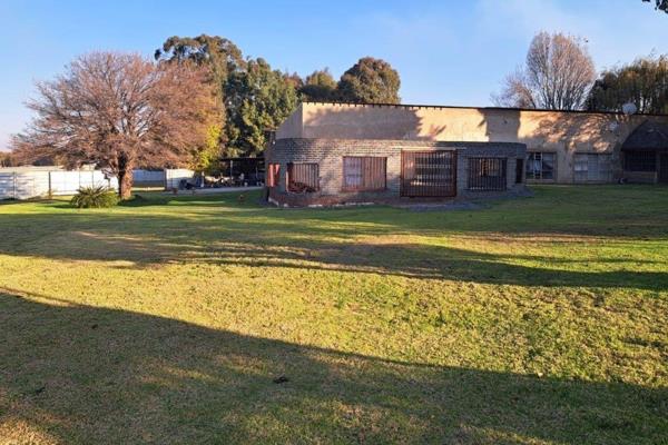 This smallholding offers spacious living with four bedrooms and three bathrooms, making ...