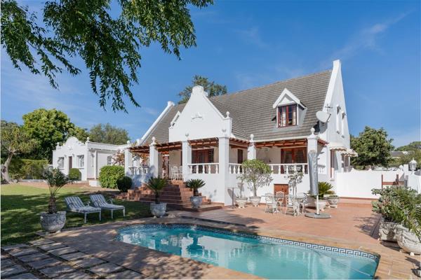 EXCLUSIVE SOLE MANDATE - Nestled against the backdrop of Somerset West&#39;s majestic landscapes, a classic Cape Dutch home stands as a ...