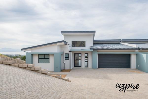 Welcome to this newly built, stylish duet nestled in the exclusive Island View enclave ...