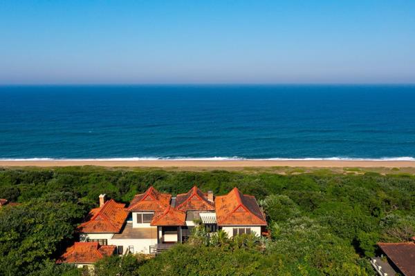 Indulge in the ultimate beachfront retreat at this stately residence, offering an ideal ...