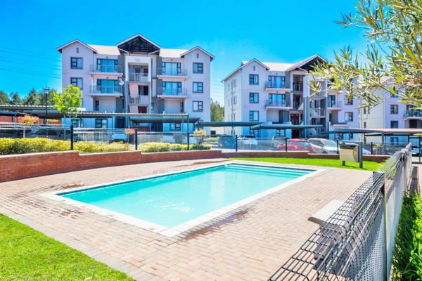 Entrance hall, lounge and dining room leading onto covered patio with built in gas braai
Kitchen with gas cooking, breakfast nook and ...