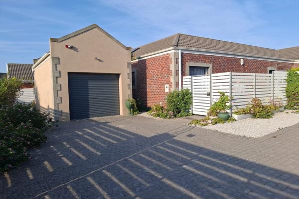 Stunning stand-alone sectional title home in a tranquil Pinelands complex, boasting only ...