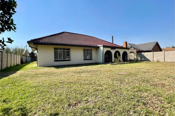 Step into this beautifully renovated home featuring a spacious living area complete with a built-in fireplace, perfect for cozy ...