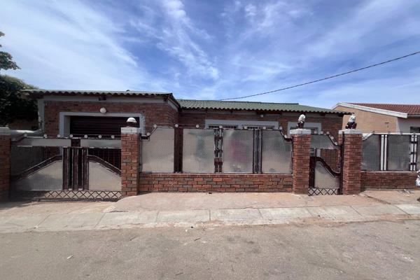 Lovely house situated in Soweto on Sea with 2 bedrooms, living room, fitted kitchen, bathroom, outside toilet, 3 flatlets and boundary ...