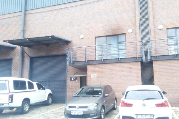 Secure warehouse unit with approx 50 m2 office space , high ceilings and a large roller ...