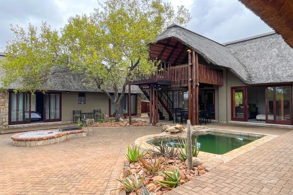 This fully furnished and recently renovated 4-bedroom guest house is for sale in the popular Hoedspruit Wildlife Estate.

The property ...