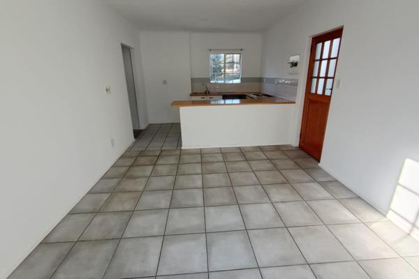 North facing, large lounge area leading to open plan kitchen with a large dividing ...