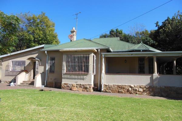 This lovely four bedroom family home with double electric garage and expansive garden is ...