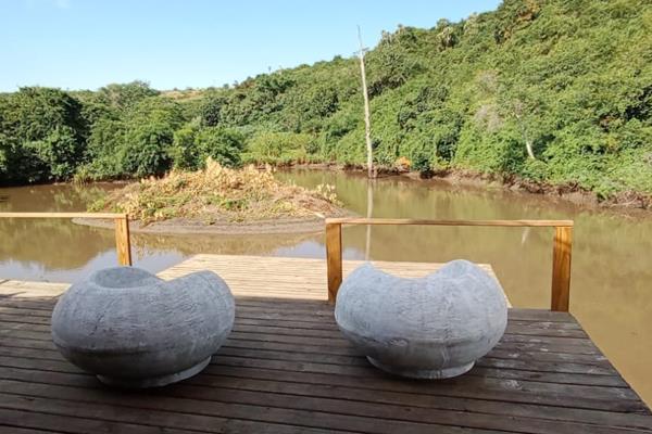 12,784 m&#178; land with Gonubie River frontage and a pond on side, 
Two lovely tented camps available for immediate living whilst ...