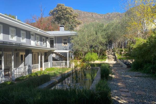 Surrounded by majestic mature trees in a tranquil part of Riebeek West, this family home ...