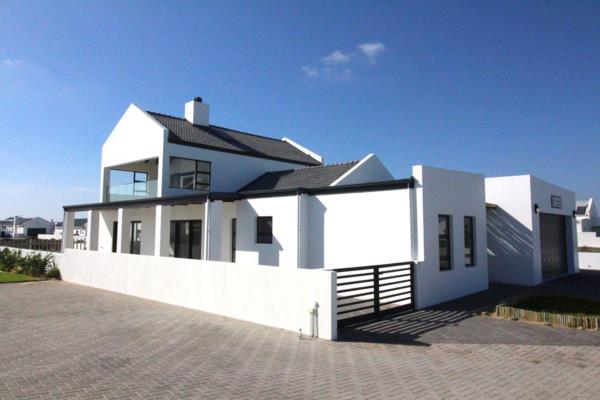 This exquisite, double-storey, modern house is just a stone&#39;s throw away from the breathtaking Atlantic Ocean and beach. This ...