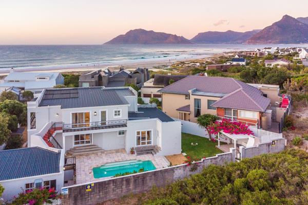 Making the most of its coastal setting in the village of Kommetjie this magnificent ...