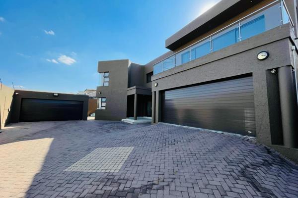 Ultra modern double story six bedroom home in a prime location | four garages | includes ...