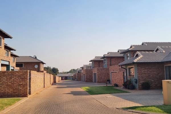 Welcome to Black Olive Estate, where contemporary design meets convenience and security. This newly built, modern townhouse is now ...