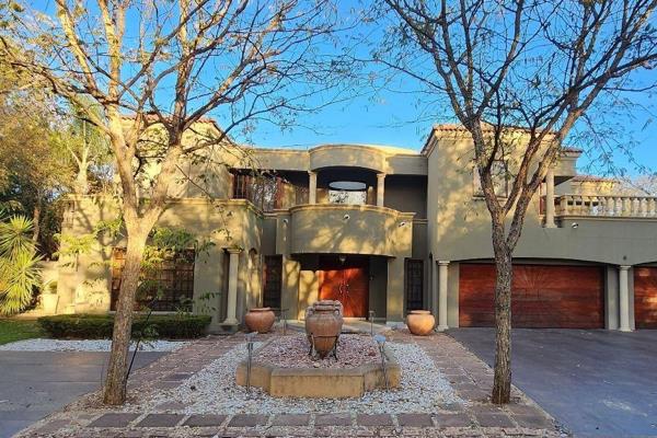 This exquisite 5-bedroom mansion, located in the prestigious Cycad Estate in Polokwane&#39;s upscale Bendor neighbourhood, offers ...