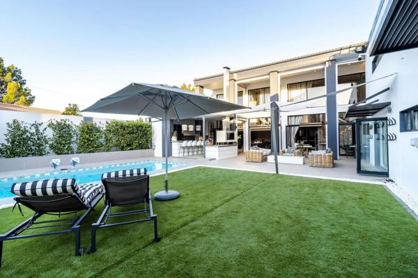 Welcome to an unparalleled living experience in the heart of Durbanville, Cape Town. This magnificent 7-bedroom residence spans 410sqm ...