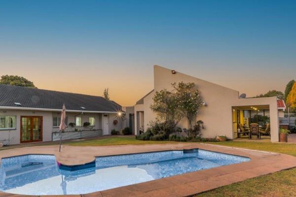 This modern family home features a welcoming tiled entrance, study, Large sunny open ...