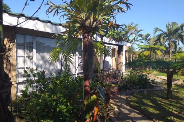 Experience the charm of country living just a 5-minute drive from the popular beach of Mtwalume. This charming four-bedroom home offers ...