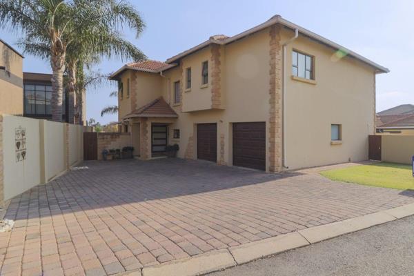 Discover this elegant double-storey home in the family-oriented, AAA Security Estate of Glen Erasmia Boulevard, offering everything you ...