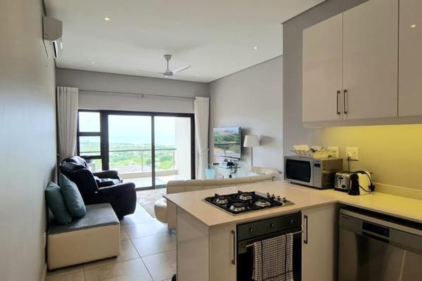 Upon entering the unit, you&#39;ll find open-plan living areas with a fully equipped ...