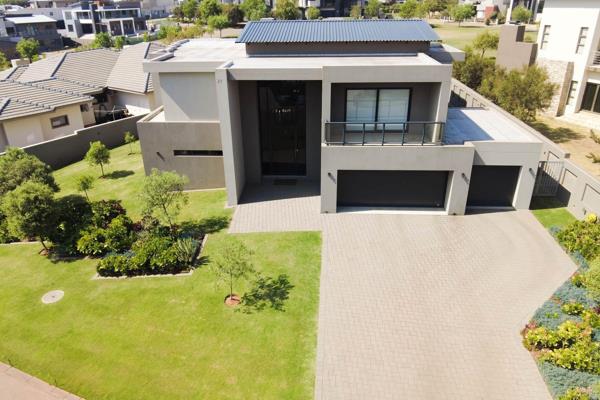 This beautiful family home is located on the prestigious Eye of Africa golf estate and ...