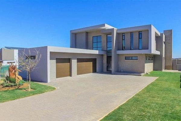 This magnificently modern masterpiece, gorgeously located in the Mecca of estate living ...